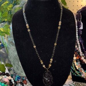 Elegant Smokey Quartz and Golden Rutile beads with a Rainbow Obsidian Buddha